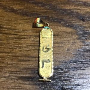 Gold plated hieroglyphic Kim pendant.